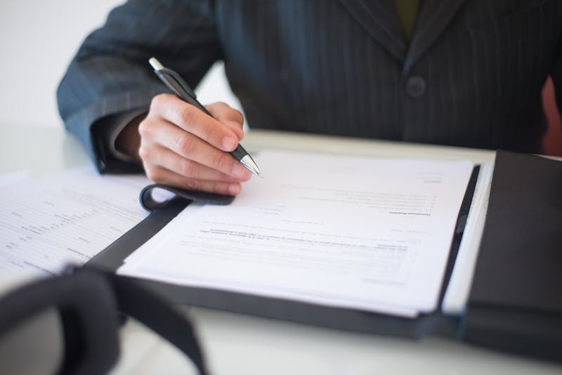 Person signing a personal liability insurance contract in Germany