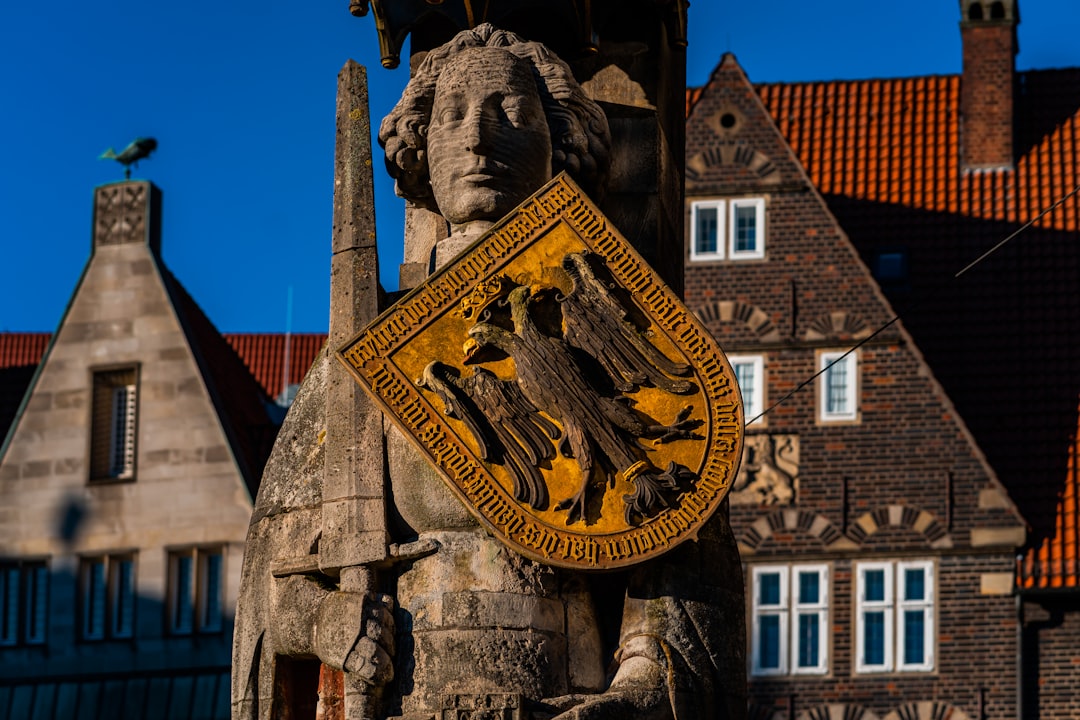 Person completing liability insurance application online on laptop in Germany